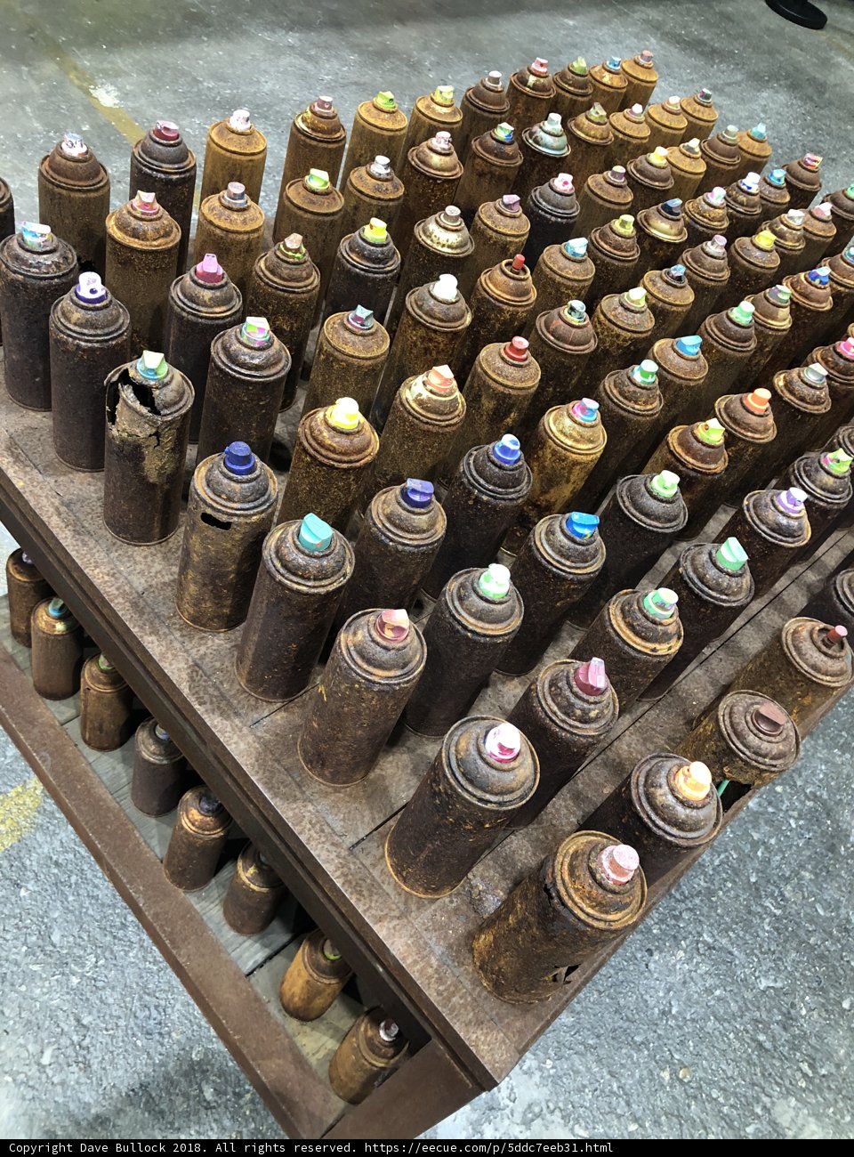 Colorful Paint Cans on a Wooden Table