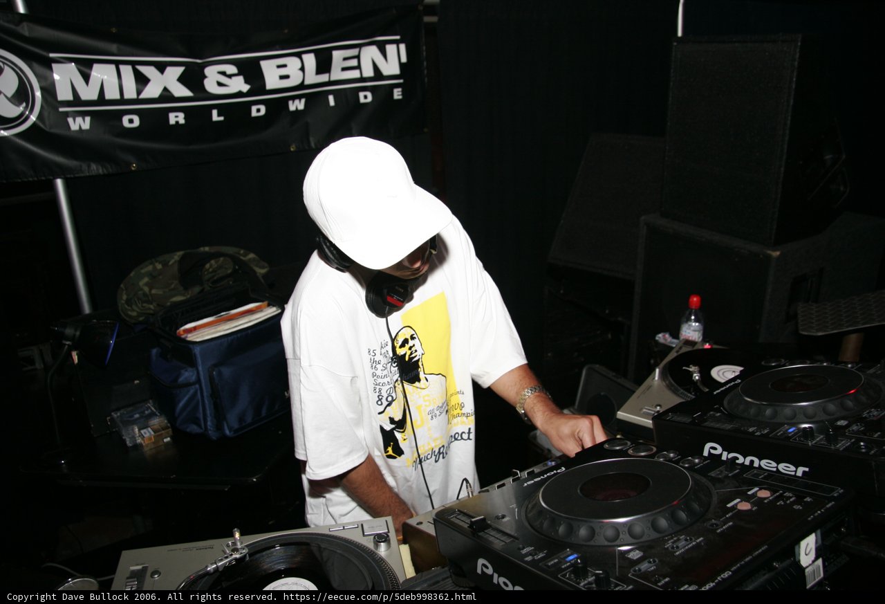 DJ in White Hat Entertaining Crowd