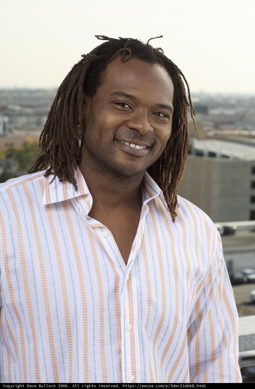 Dreadlocked Man on Balcony