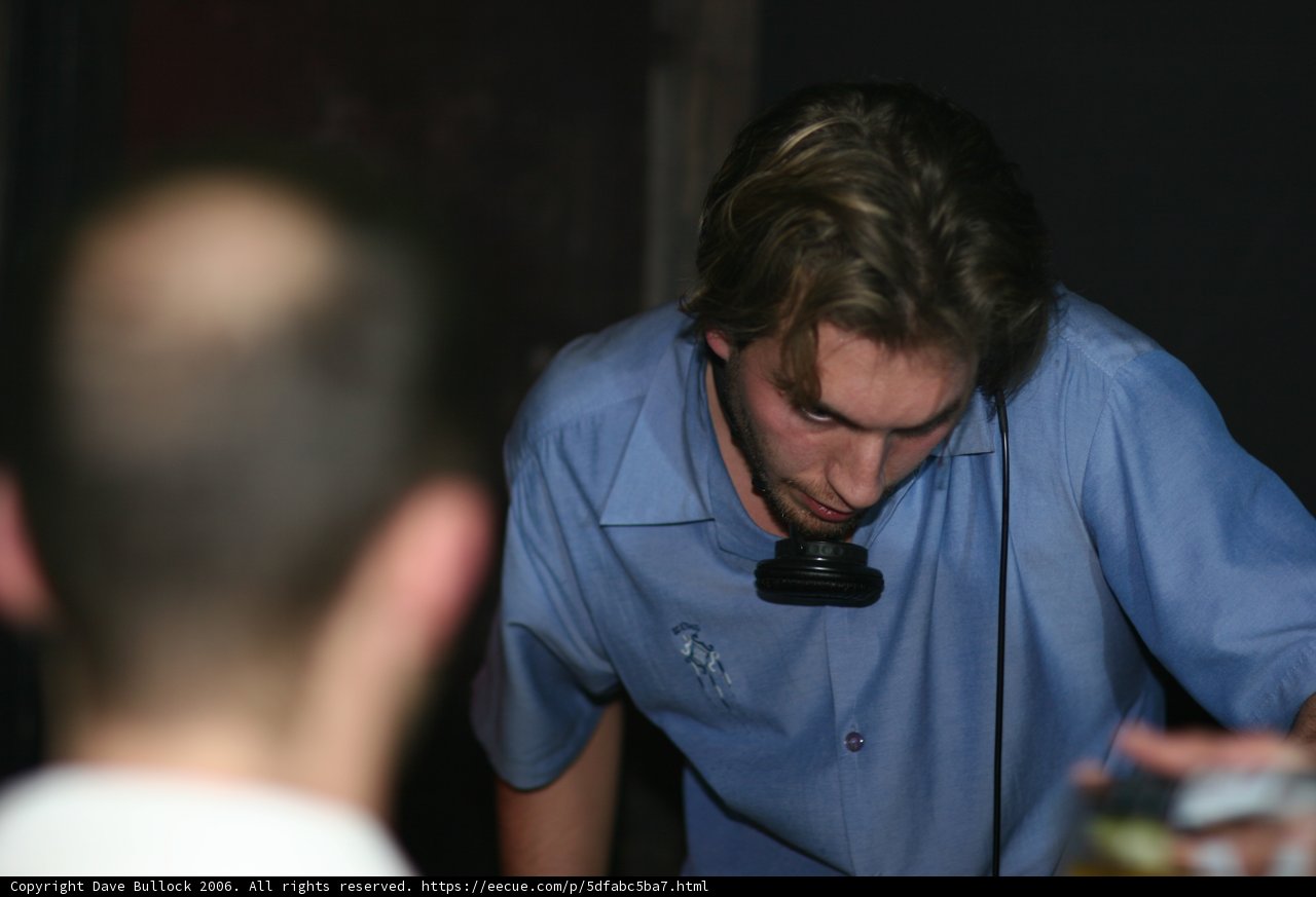 Blue-Shirted Man with Microphone