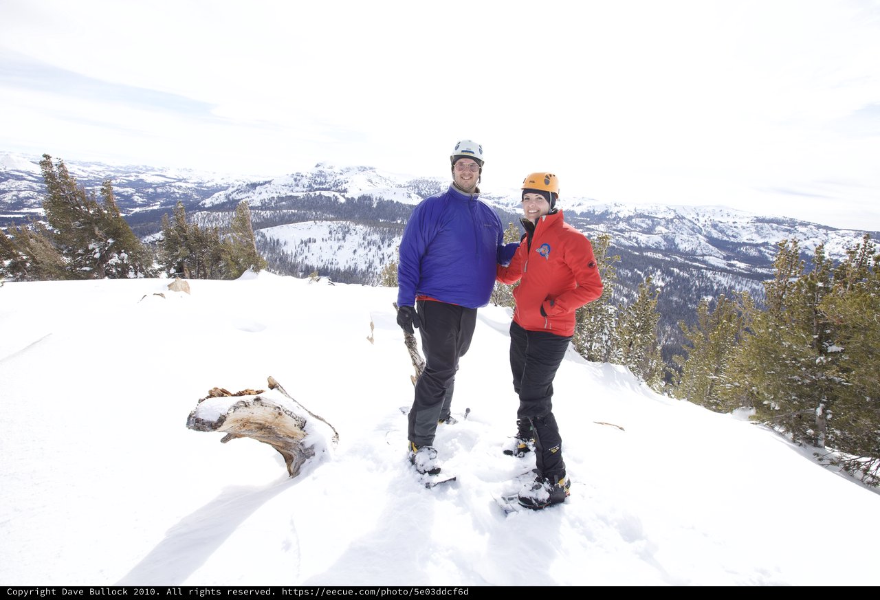 Summit Smiles: Couple Conquers Snowy Mountain Peak