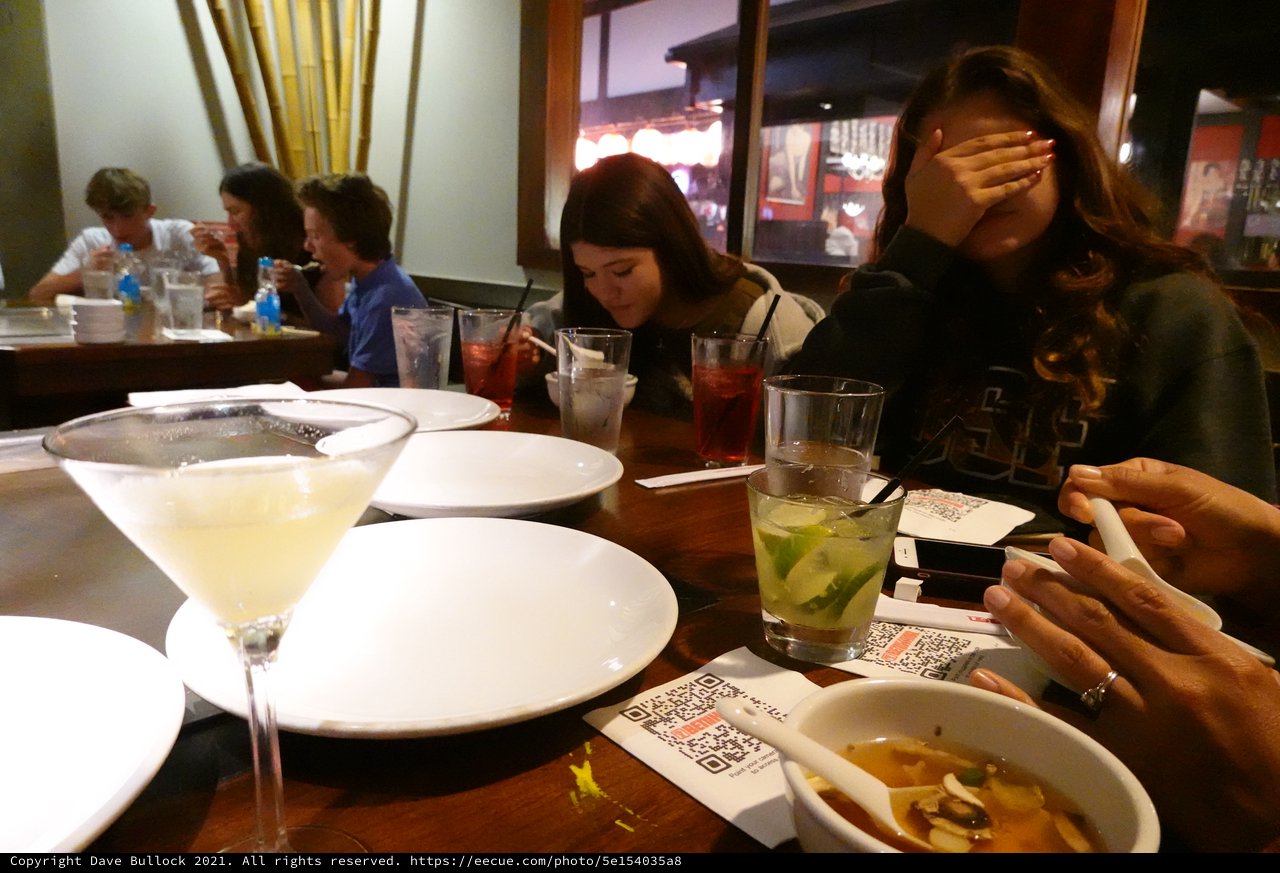 Friends Dining Together at Restaurant Table