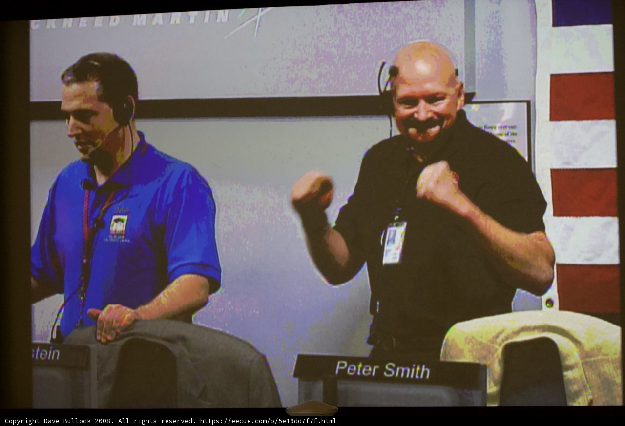 Two Men Discussing at a Seminar
