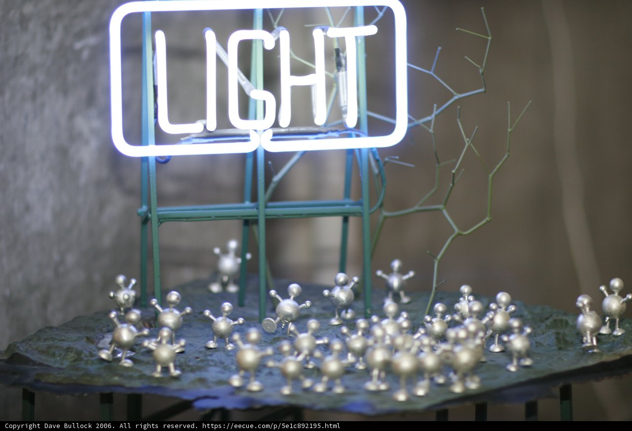Radiant Neon Light and Silver Figures