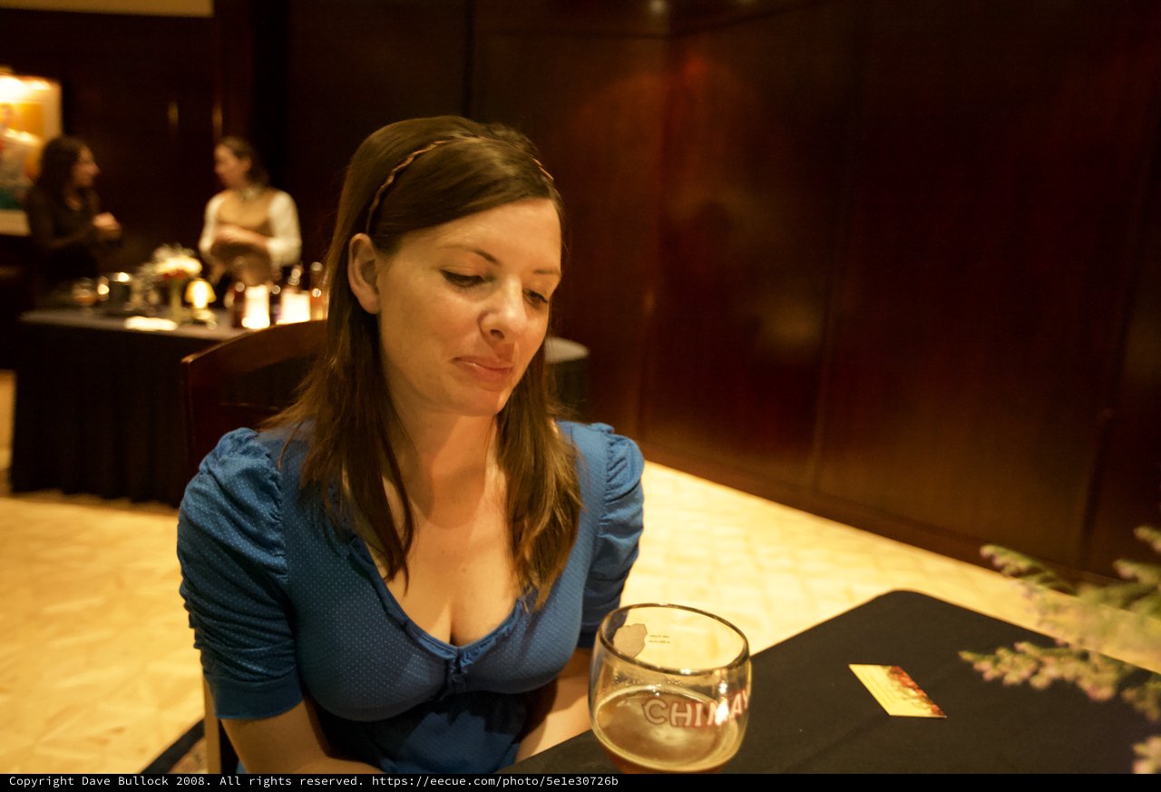 Woman Contemplating Over Chimay Beer at Bar