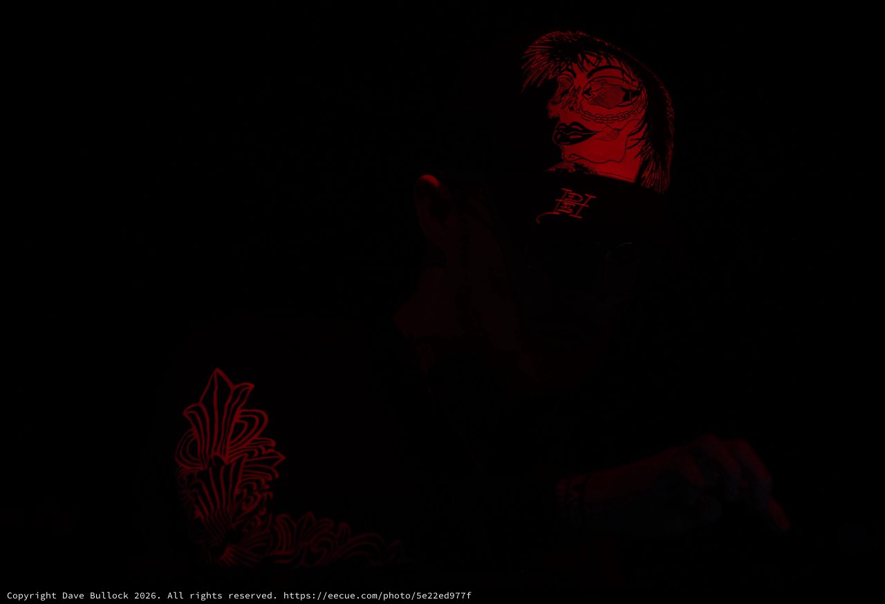 Red Shadows: Tattoo Art in Dark Performance Light