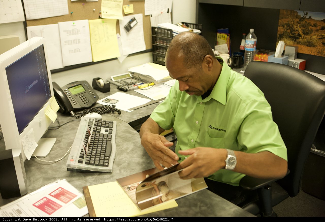 Green-Shirted Man Hard at Work