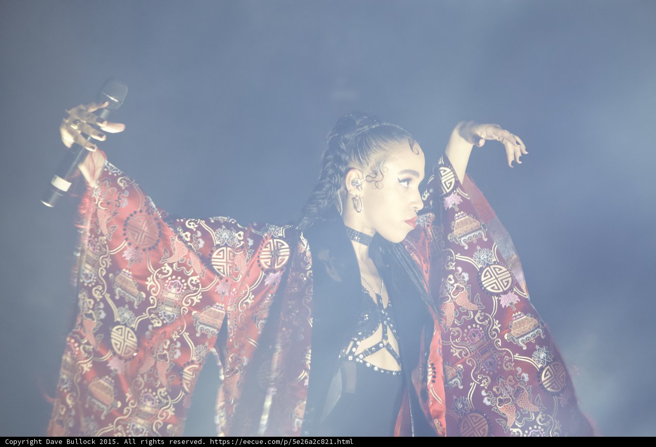 FKA twigs Arms Spread Microphone Red Brocade Kimono Baby Hairs Hoop Earrings Black Strappy Outfit