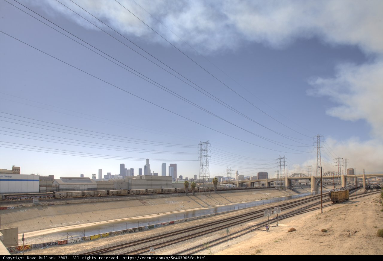 Smoky Train Passing Through the City