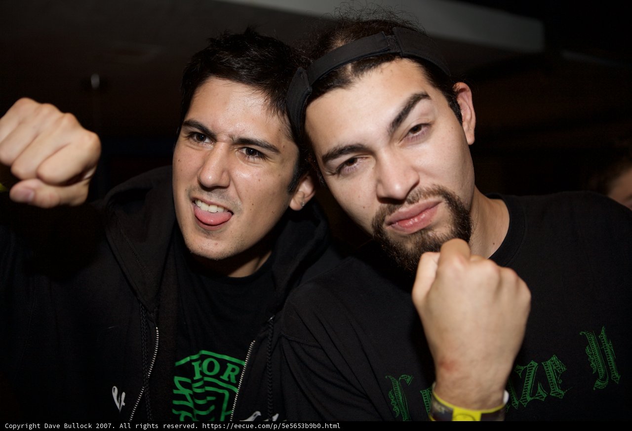 Two Men Posing for a Picture at a Party
