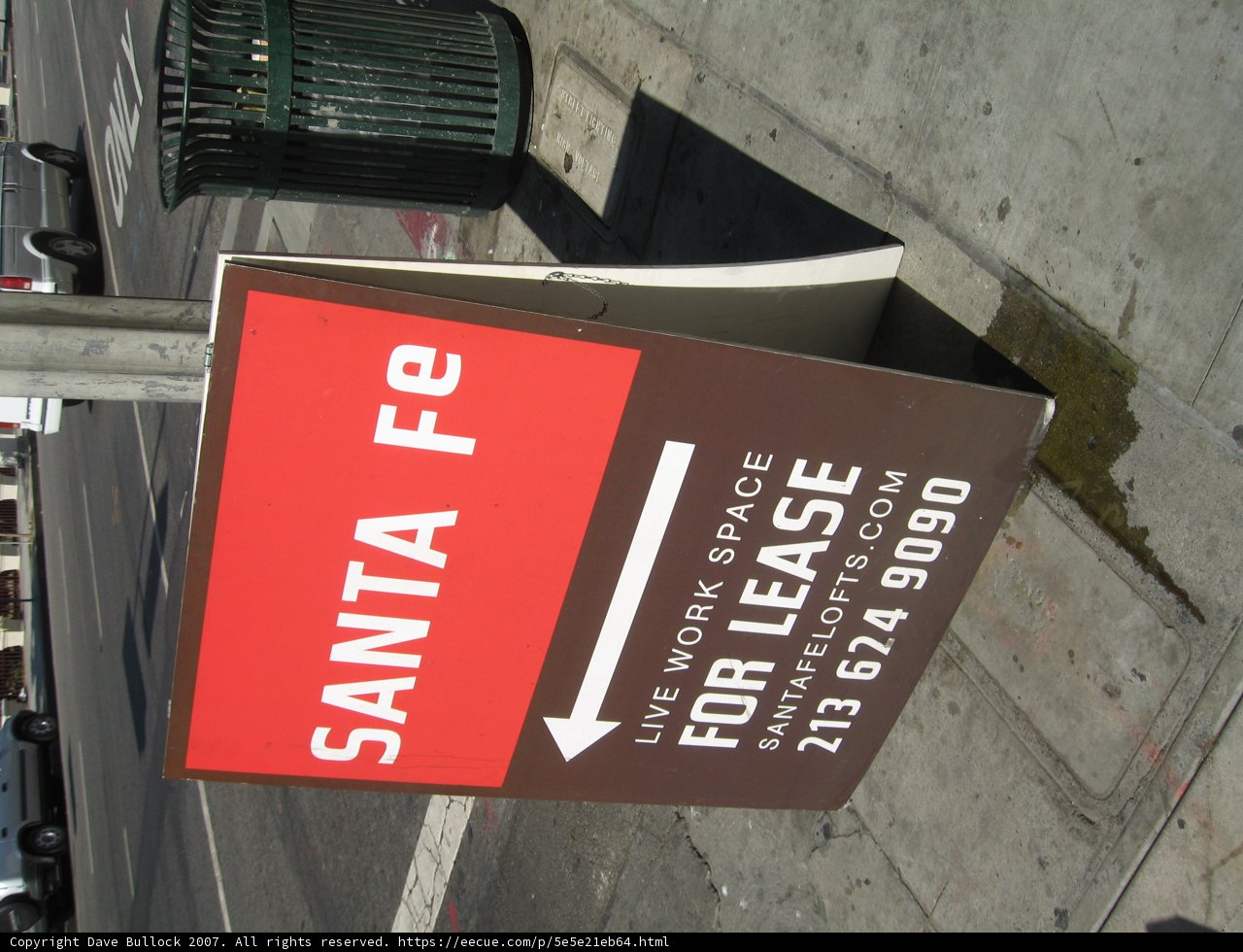 Road Sign on the City Sidewalk