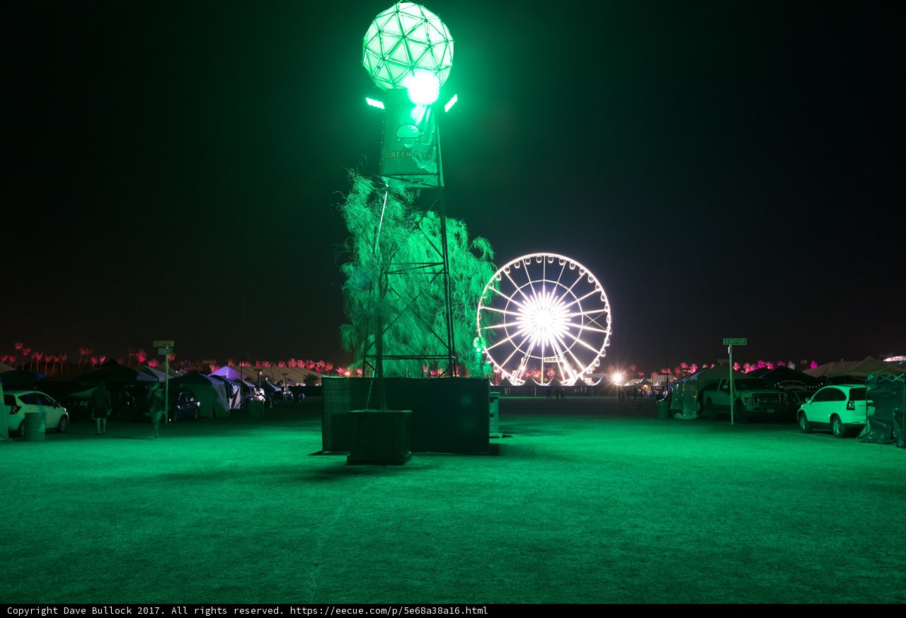Green Light Illuminates Ferris Wheel