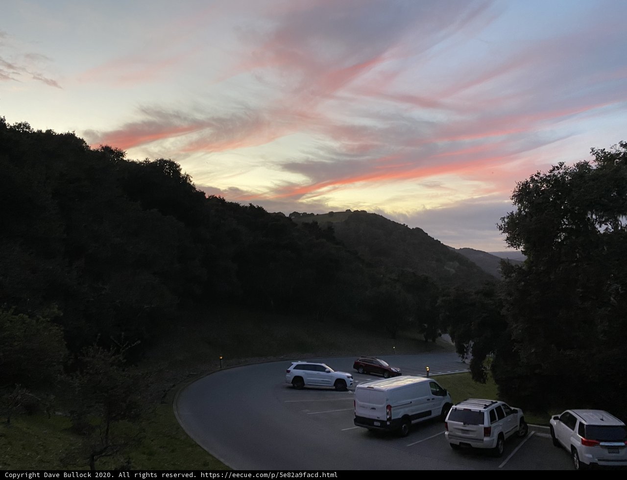 Serene Sunset with Cars Lined on the Road