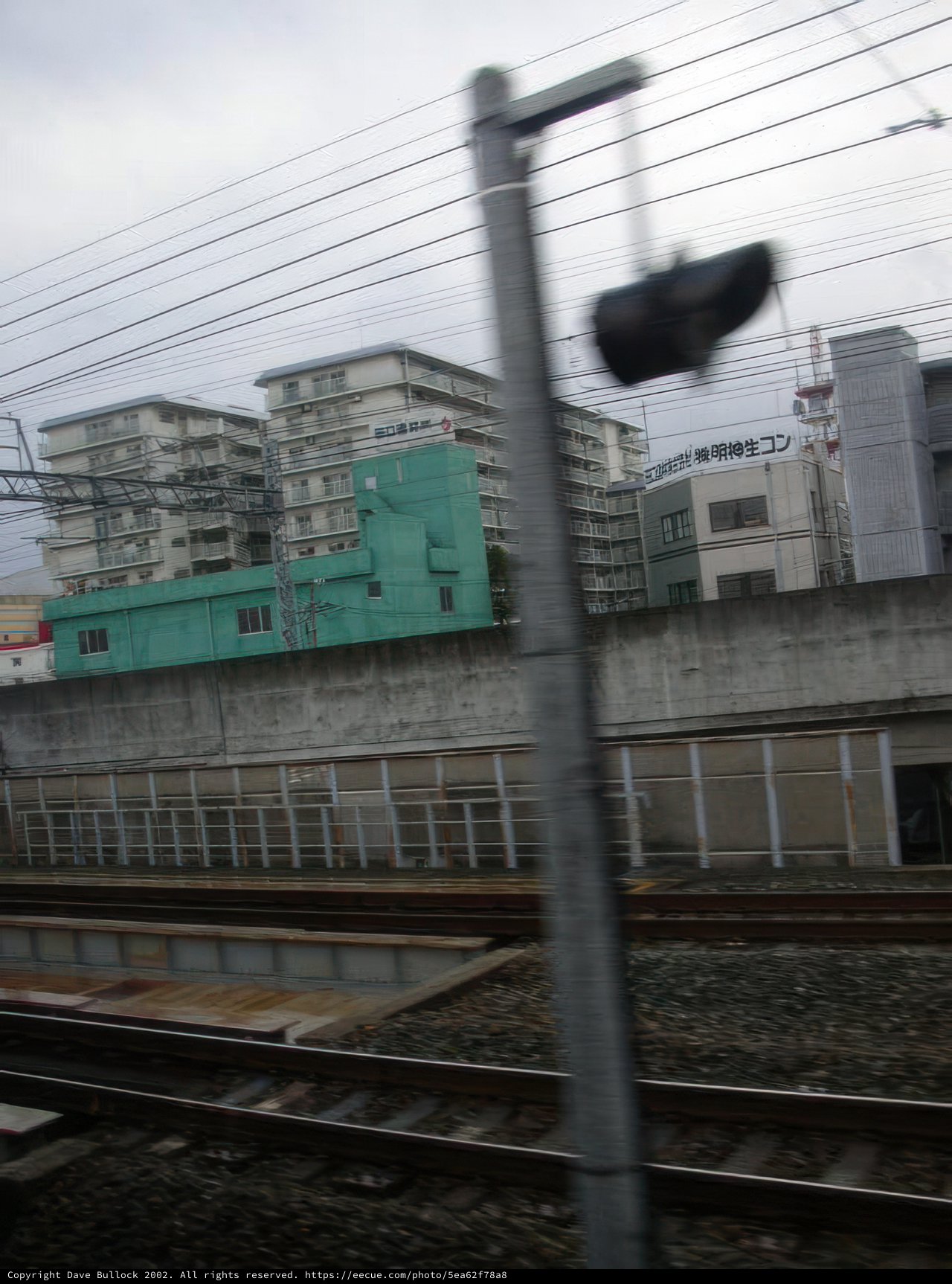 Rush Hour Train Passing by City Terminal