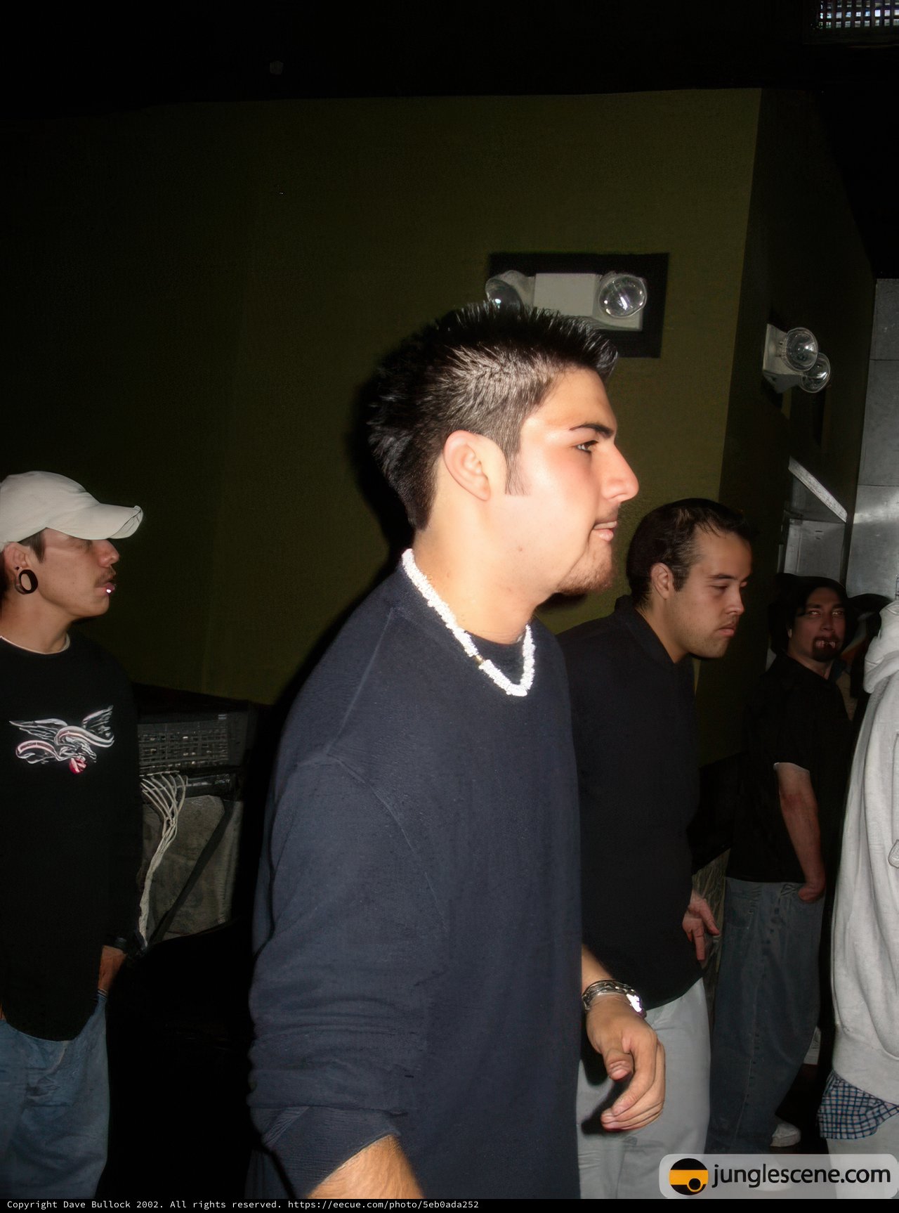 Group of Men Posing for a Portrait in a Night Club