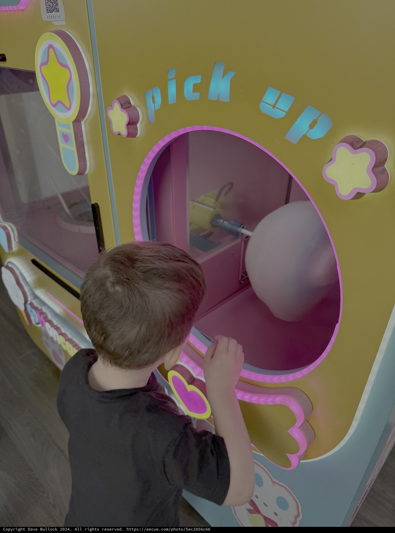 Child Playing with Interactive Arcade Game