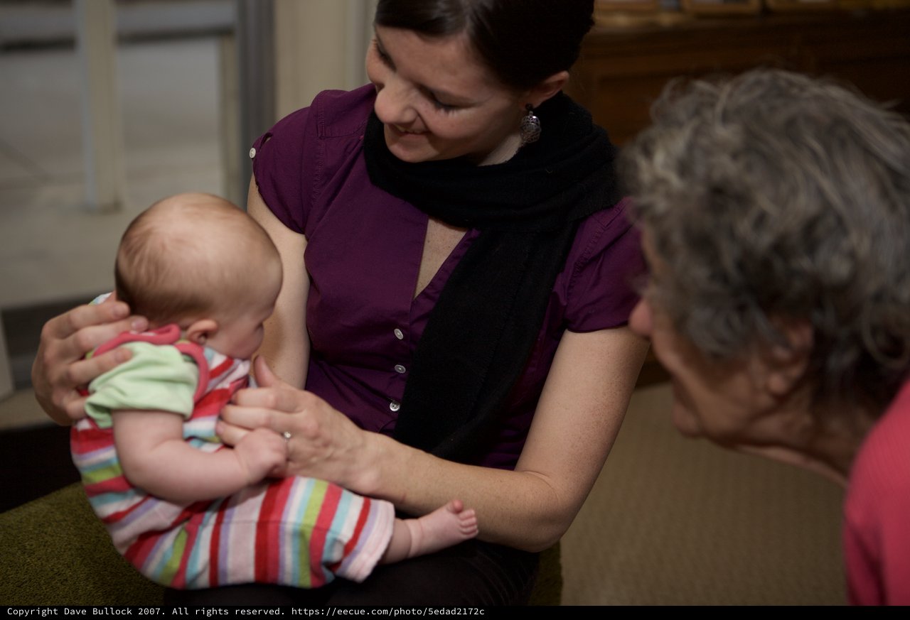 Three Generations Share a Tender Indoor Moment