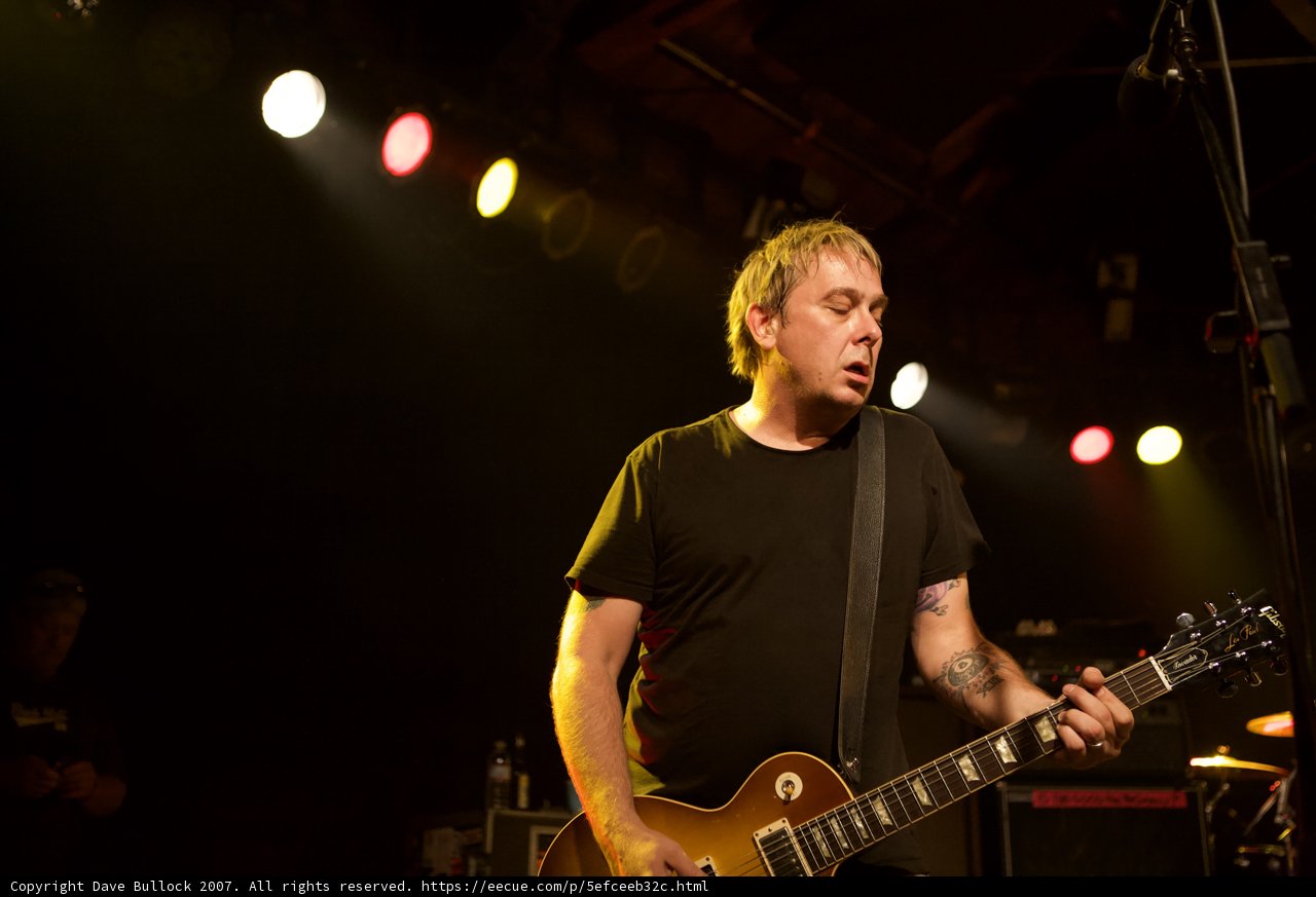 Brian Baker Rocks the Stage with His Guitar at 2007 Bad Religion Glasshouse Concert