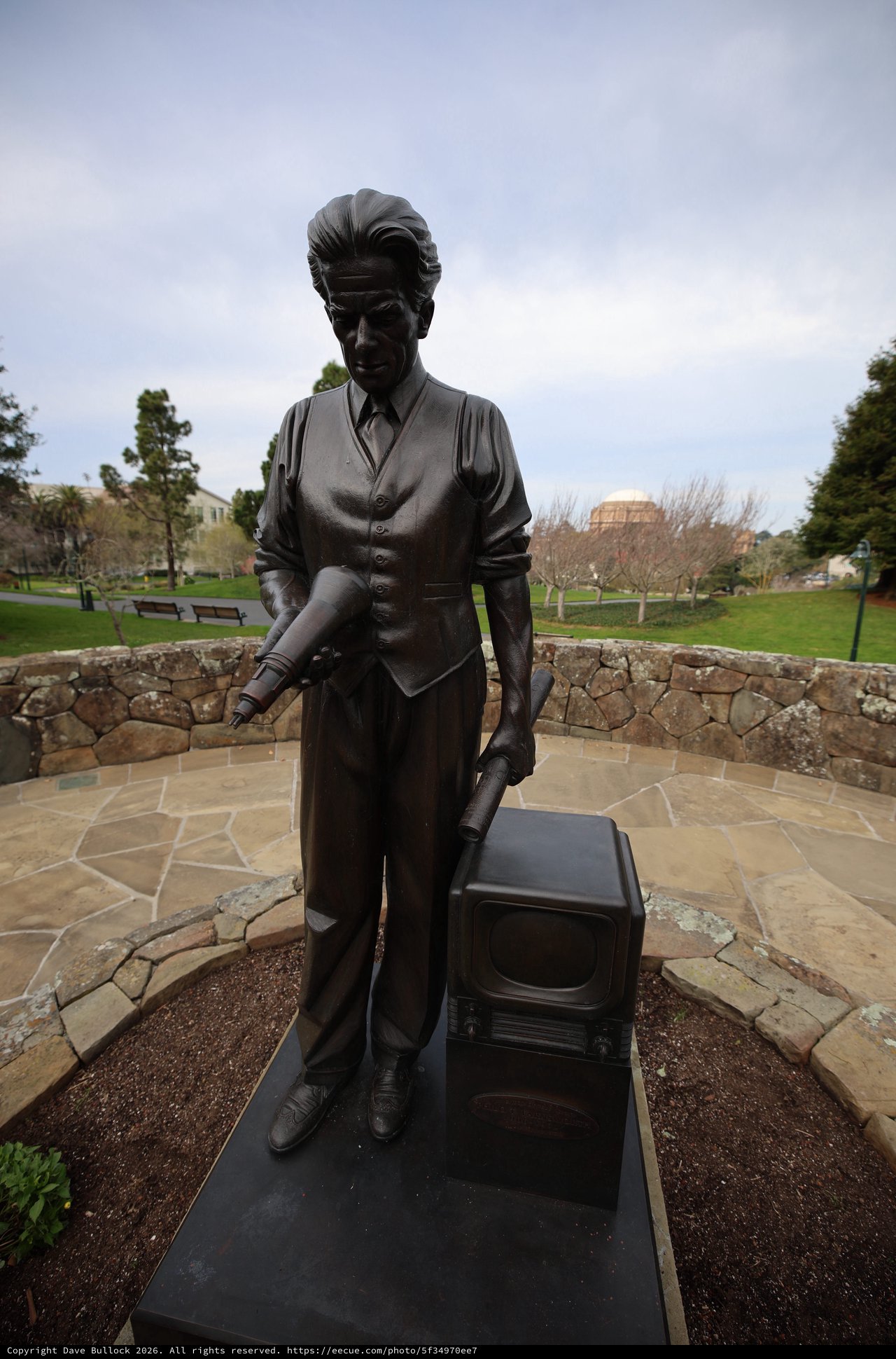 Bronze Statue of Man with Television at Memorial Site