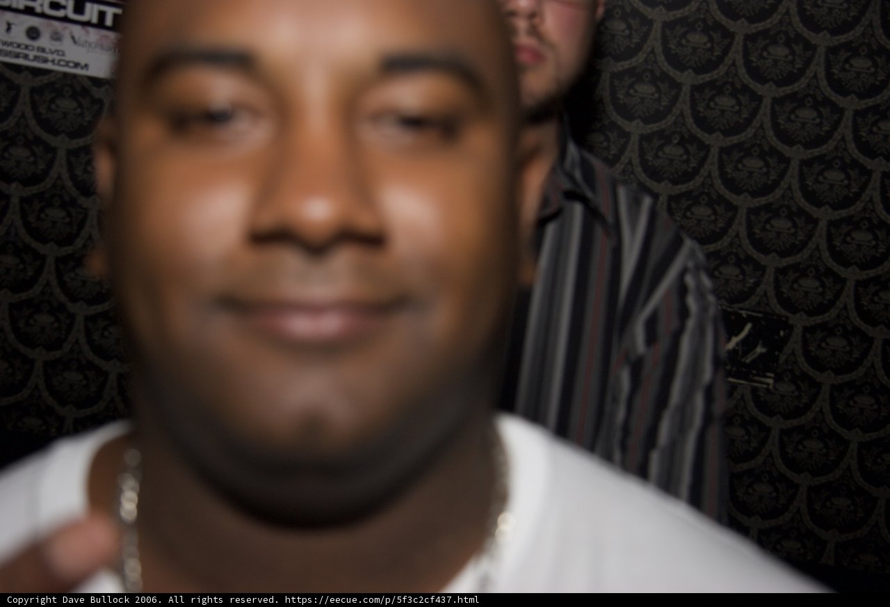 Smiling Men in White Shirt and Necklace