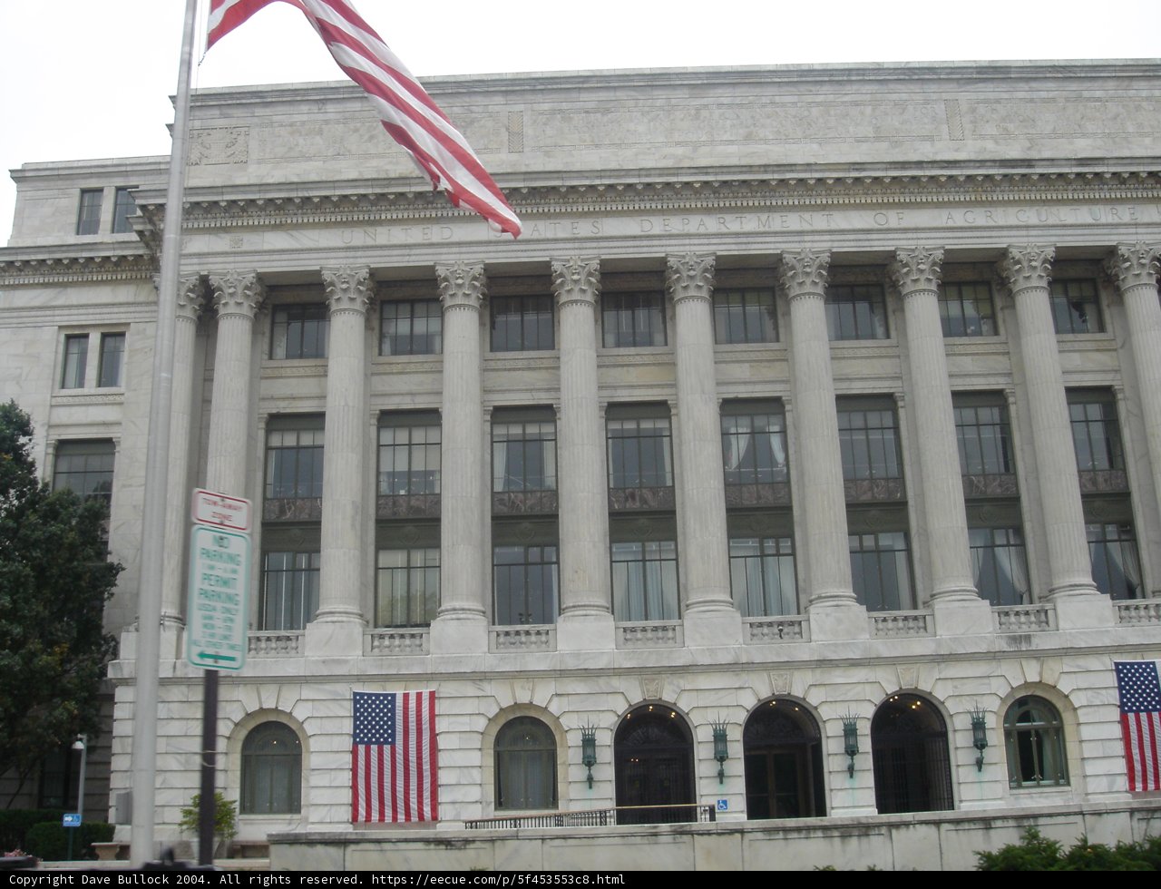 The Majestic Office Building with Flags
