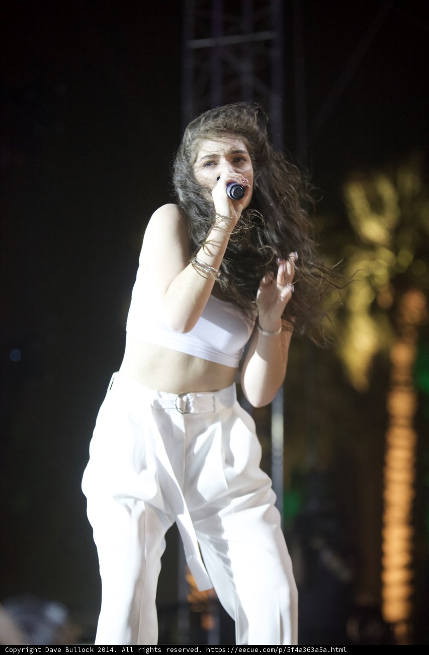 White-clad Woman Belting Out a Tune