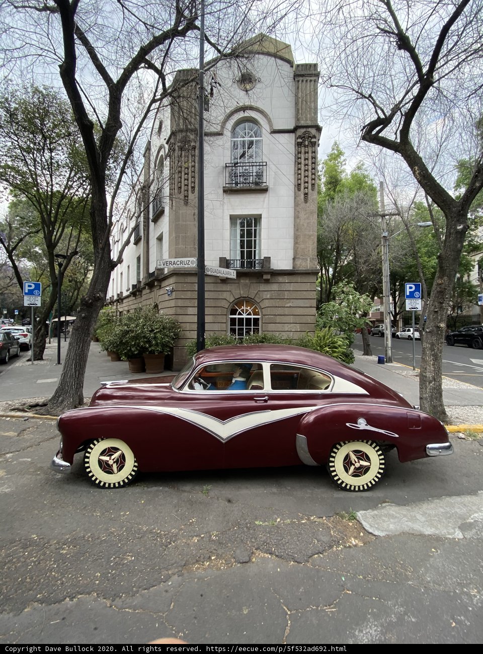 Vintage Car Parked in Urban Landscape