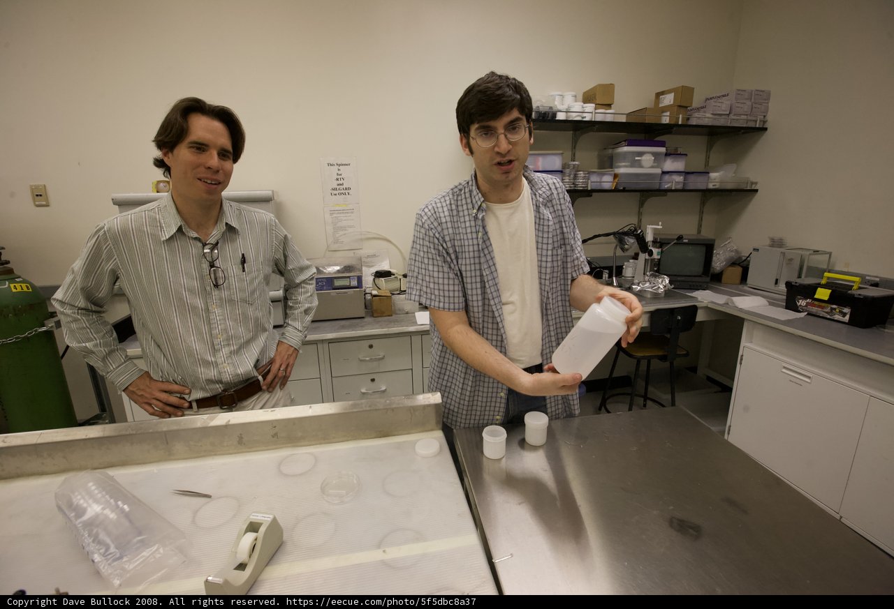 Two men conducting experiments in laboratory