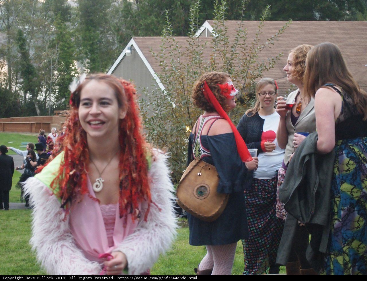 Redhead in Costume with Purse and Luggage Outdoors