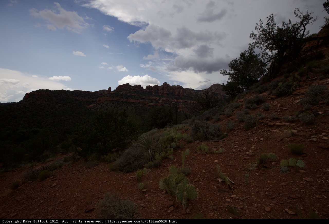 Mountainous terrain with scenic clouds