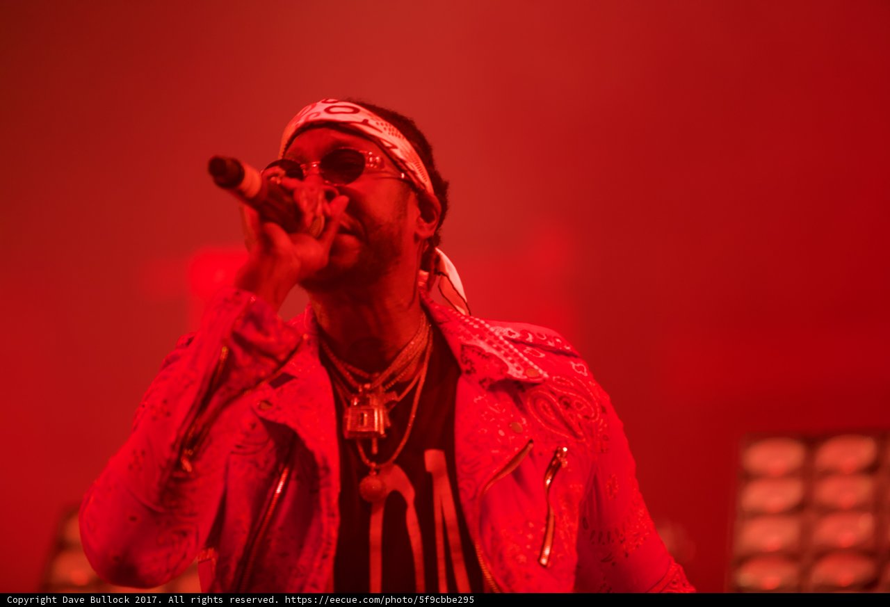 Red Jacket, Sunglasses, and a Mic