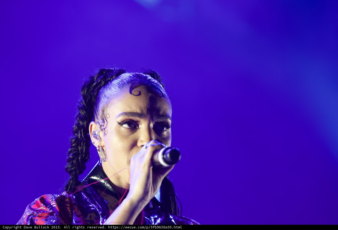 FKA twigs Incredible Close-Up Portrait Face Visible Baby Hairs Elaborate Swirls Spirals Cat-Eye Makeup Hoop Earrings Black Choker Braided Ponytails Kimono Purple Blue Lighting