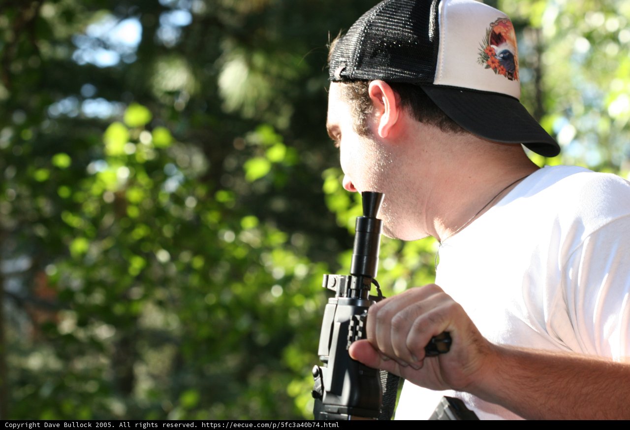 The Armed Man in the Baseball Cap