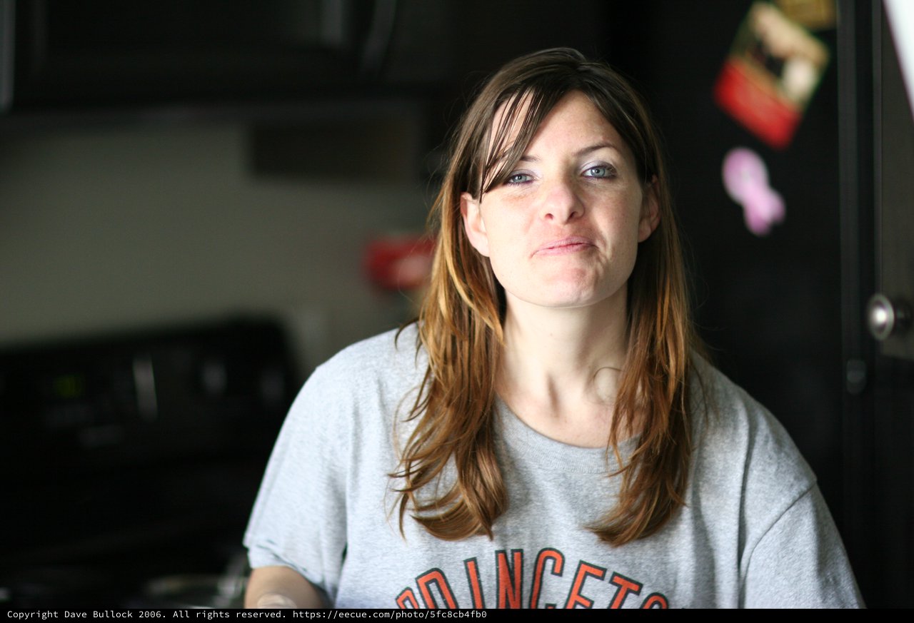 Candid Kitchen Portrait of a Thoughtful Woman