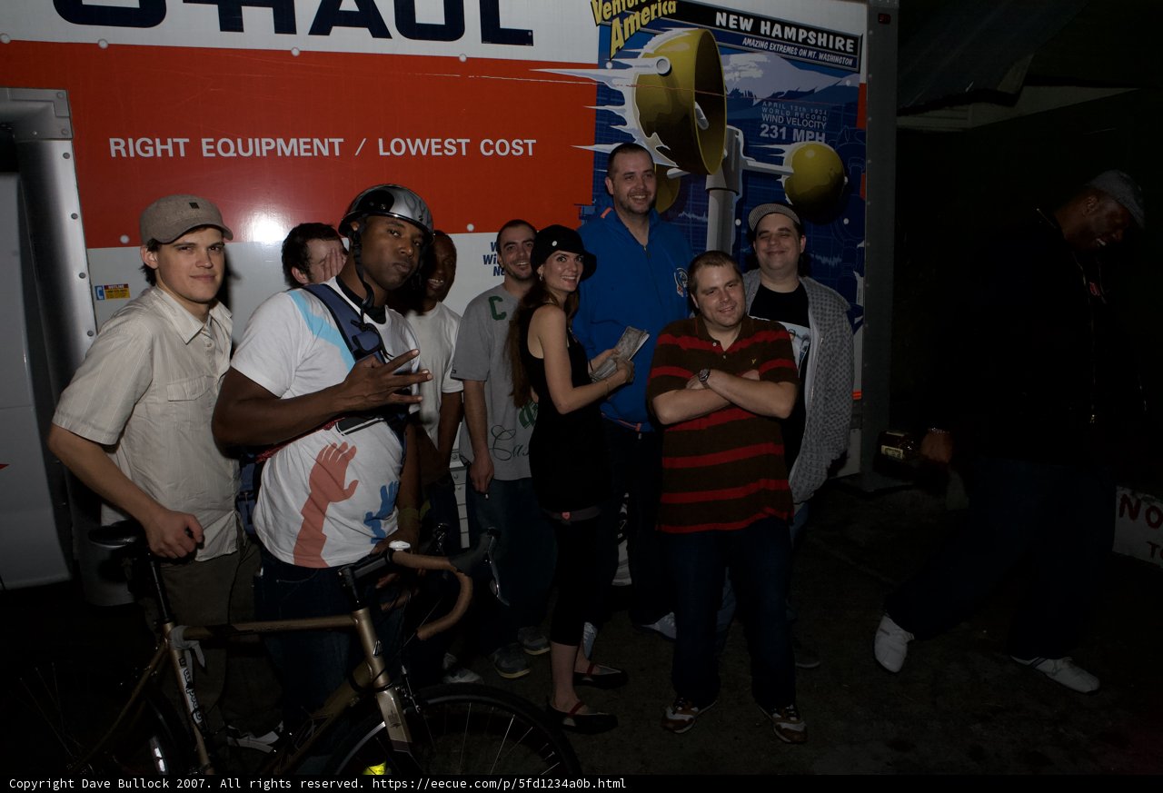 Group of Cyclists Posing in Front of Their Truck