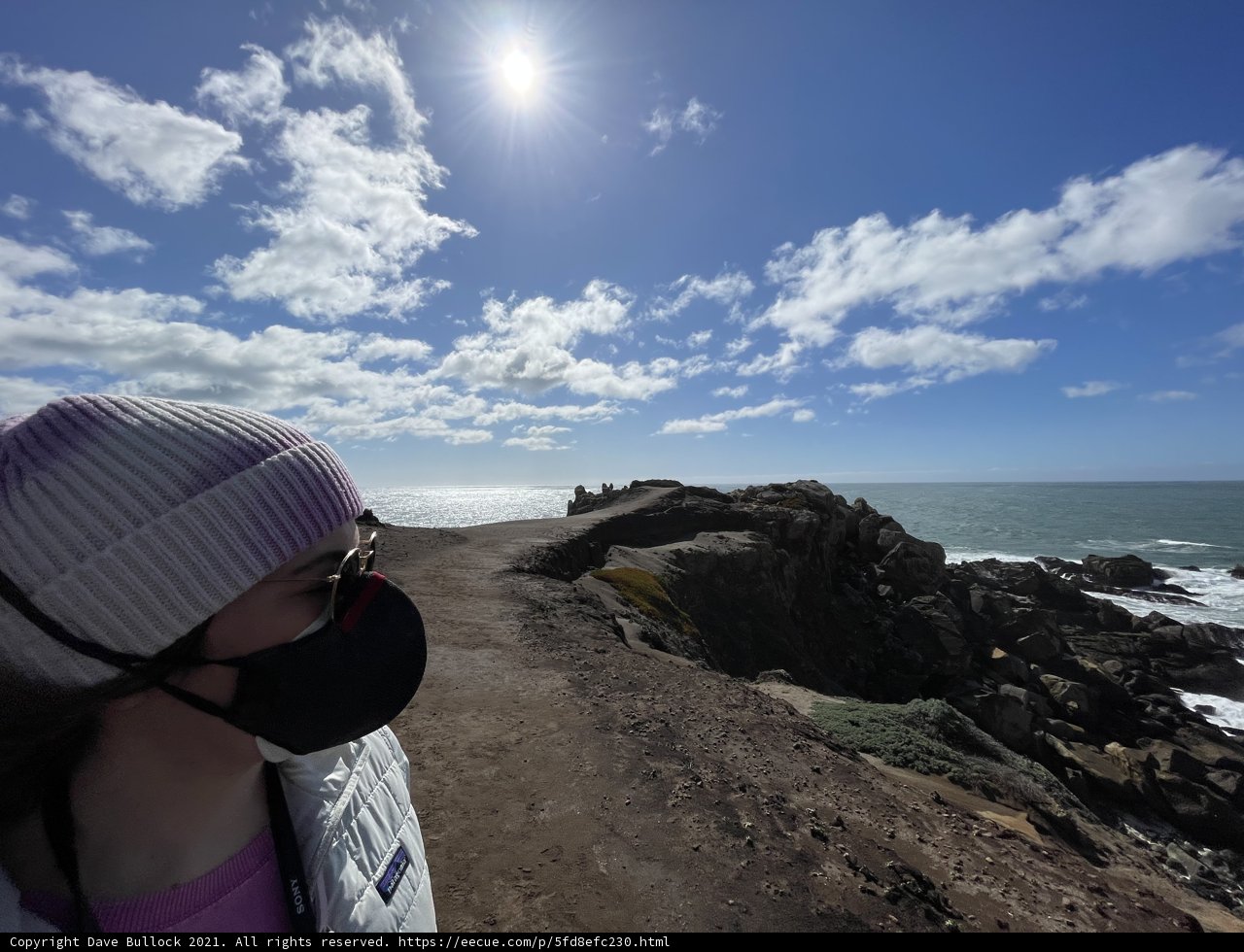 Woman on Clifftop Wearing Face Mask