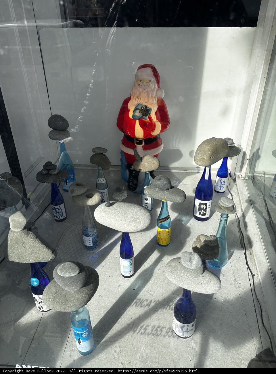 Santa Claus Statue among the Bottles