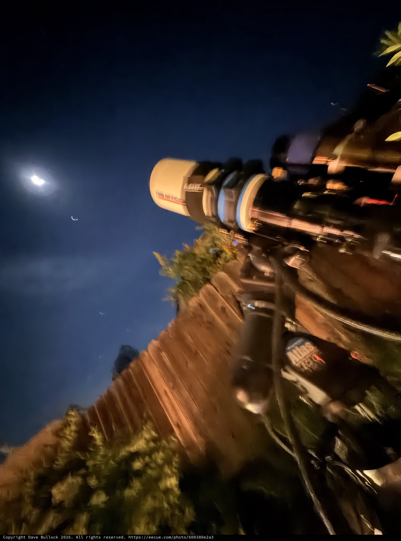 Telescope Observation Under Crescent Moon and Venus