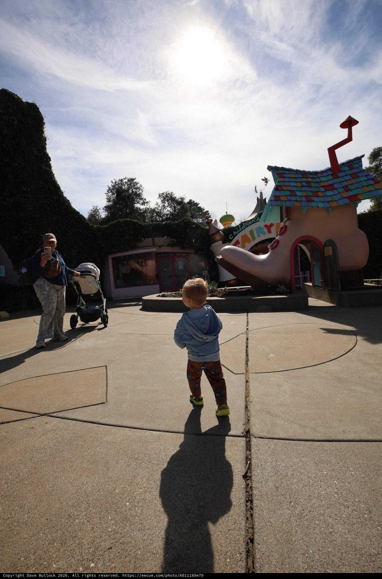 Child Exploring Whimsical Toontown at Theme Park