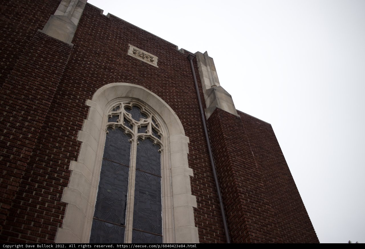 Monastery Window with Gothic Arch and Cross