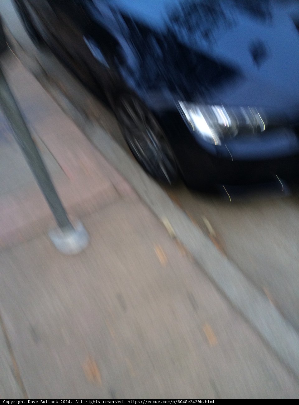 Spoked Alloy Wheel in Parked Car