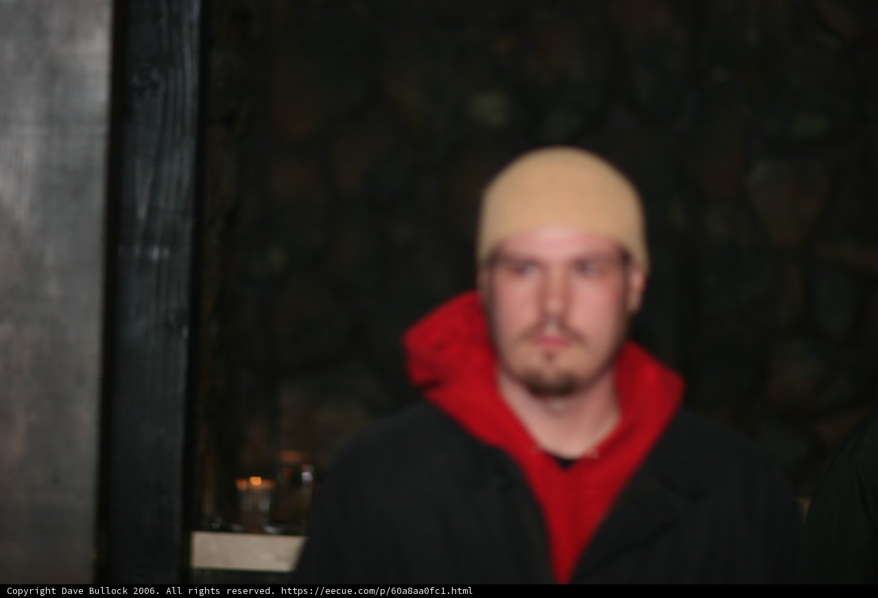 Blurred Man in Red Jacket