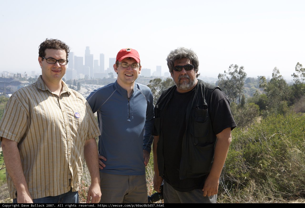 Three Men Enjoying a Sunny Day Outdoors