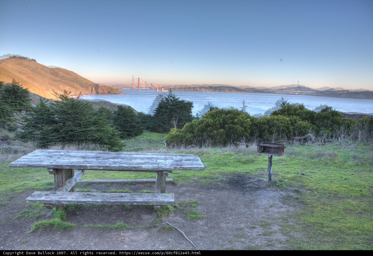 Serene View of Golden Gate Bridge from a Picnic Table on a Hill