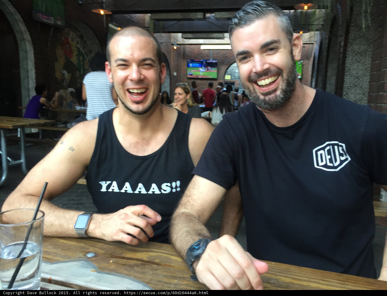 Two Friends Enjoying a Drink at a Restaurant