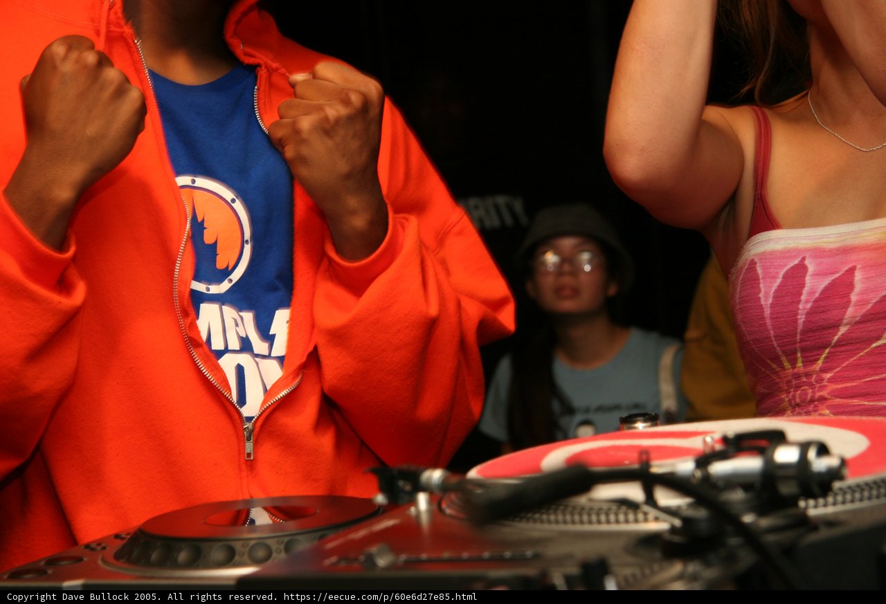 Red-Hooded DJ Spins the Night Away