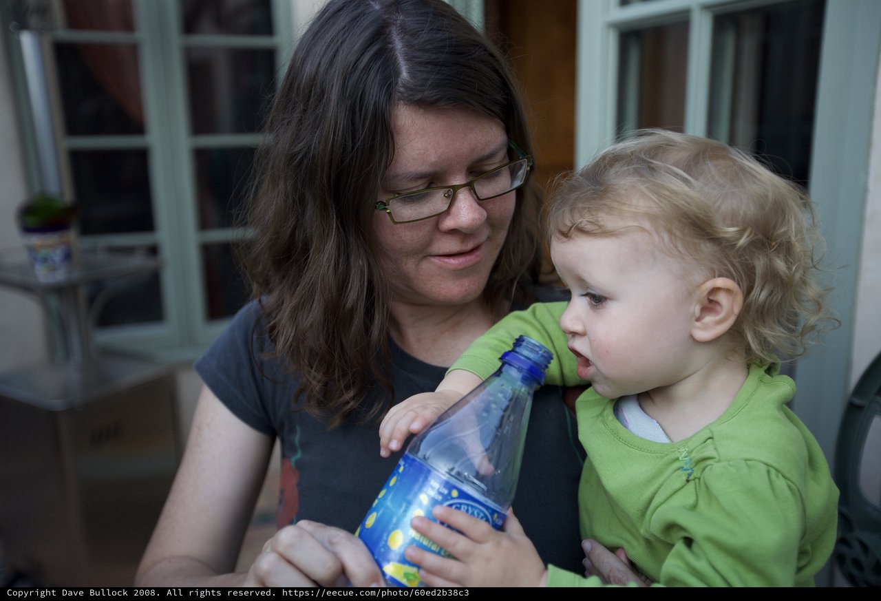 Mother and Toddler Share a Quiet Moment Outside
