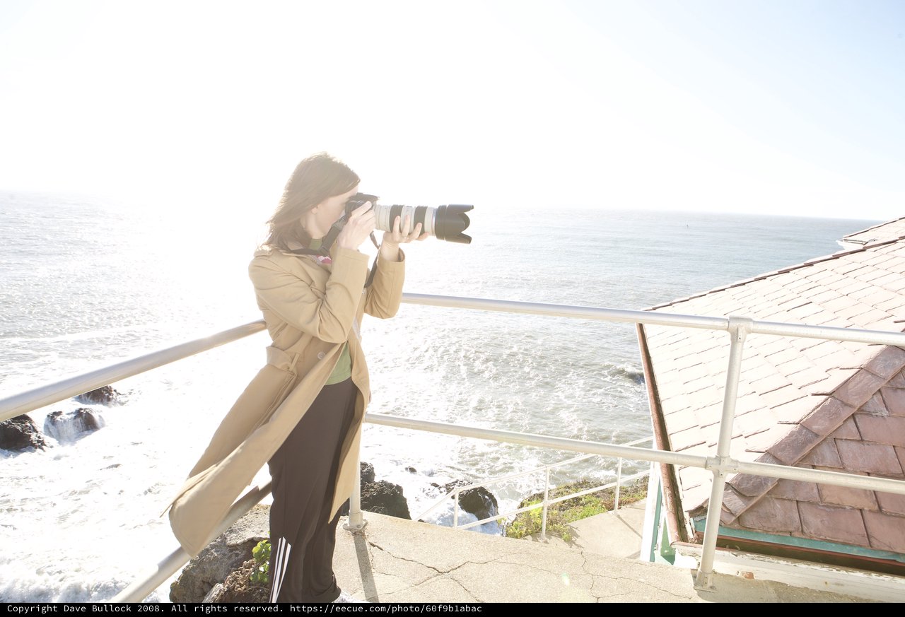 Photographer Capturing the Pacific Coast from Cliff's Edge