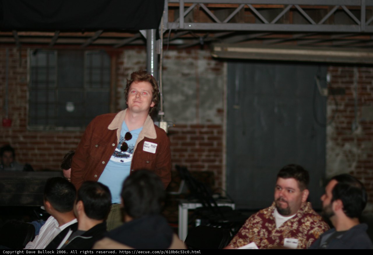 Man Giving Speech in Front of a Crowd