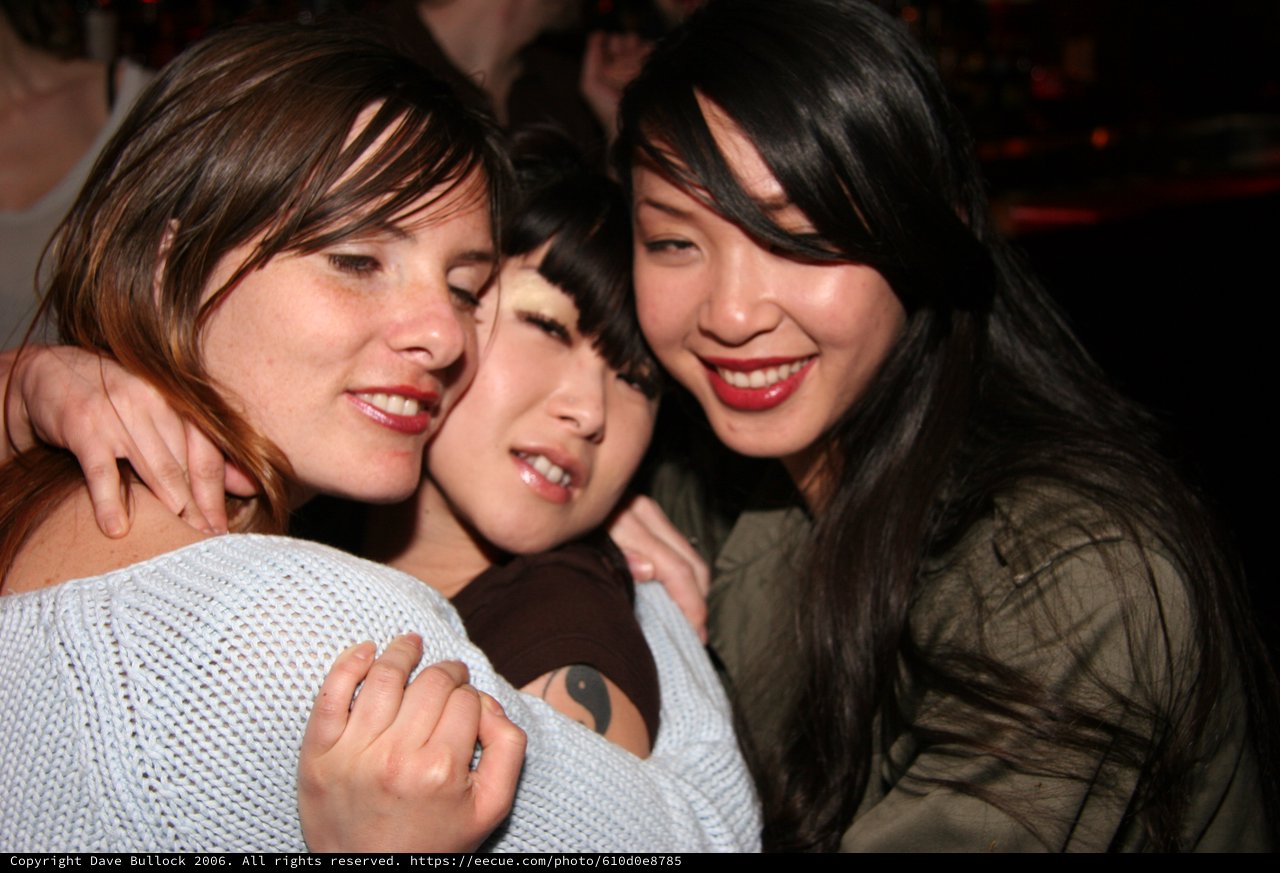 Three Friends Sharing a Joyful Close Moment